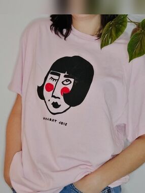 Light Pink Graphic Tee with Black & Red Face Linocut Print